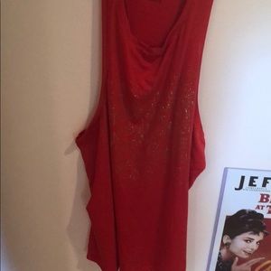 A fiery red Victoria sport shirt with gold letters